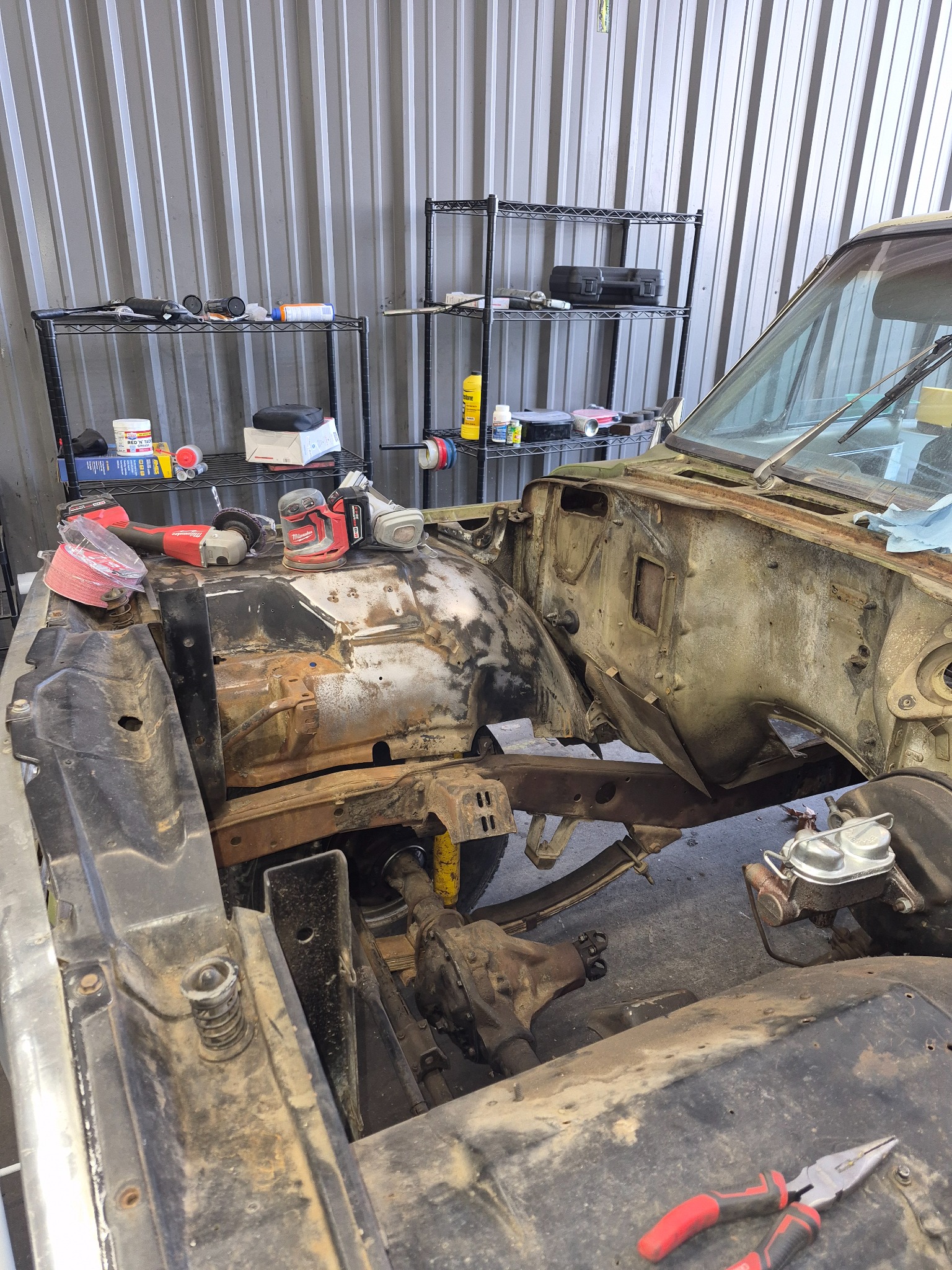 Open classic vehicle engine bay prepared for an engine swap
