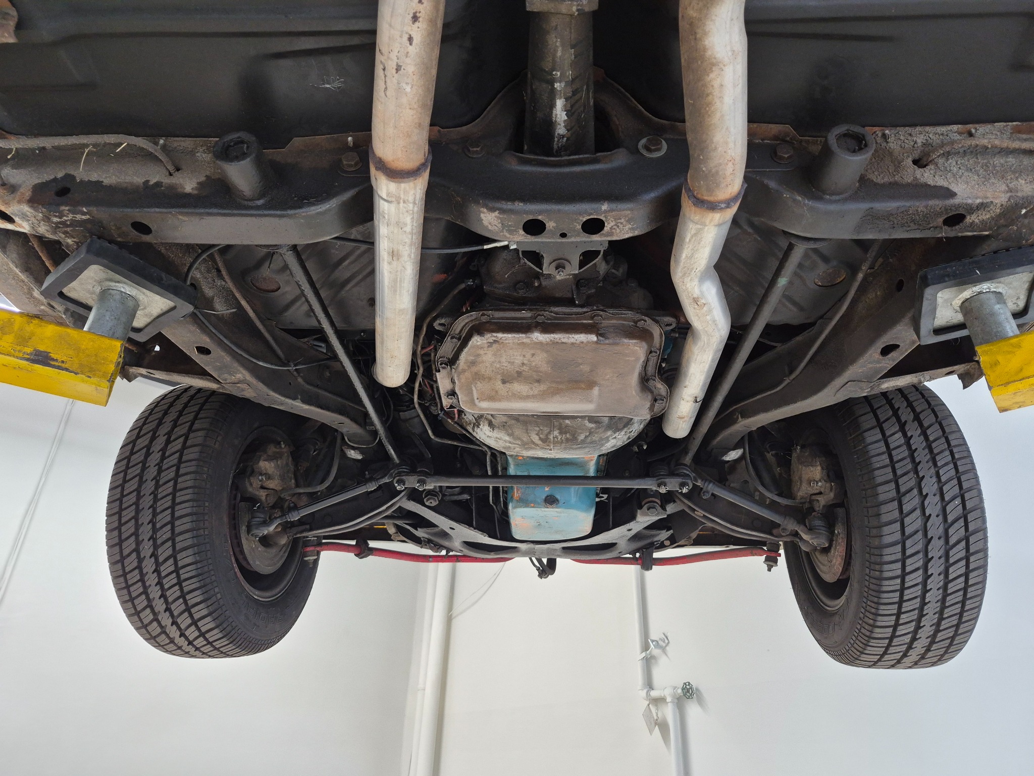 Upgraded classic vehicle undercarriage on a lift